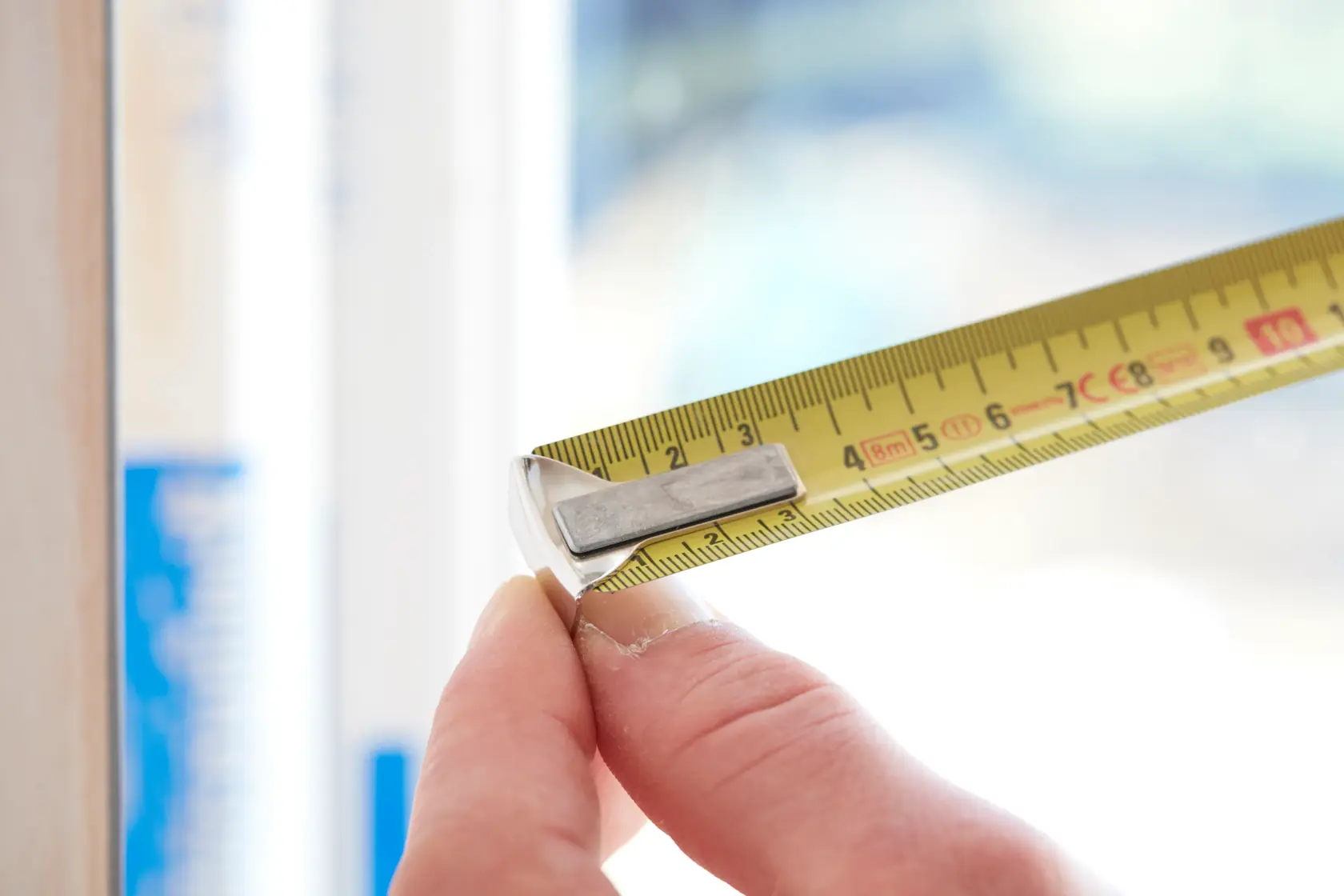 STANLEY 0-33-198 tape measure photography, close-up showing yellow blade and metal hook.