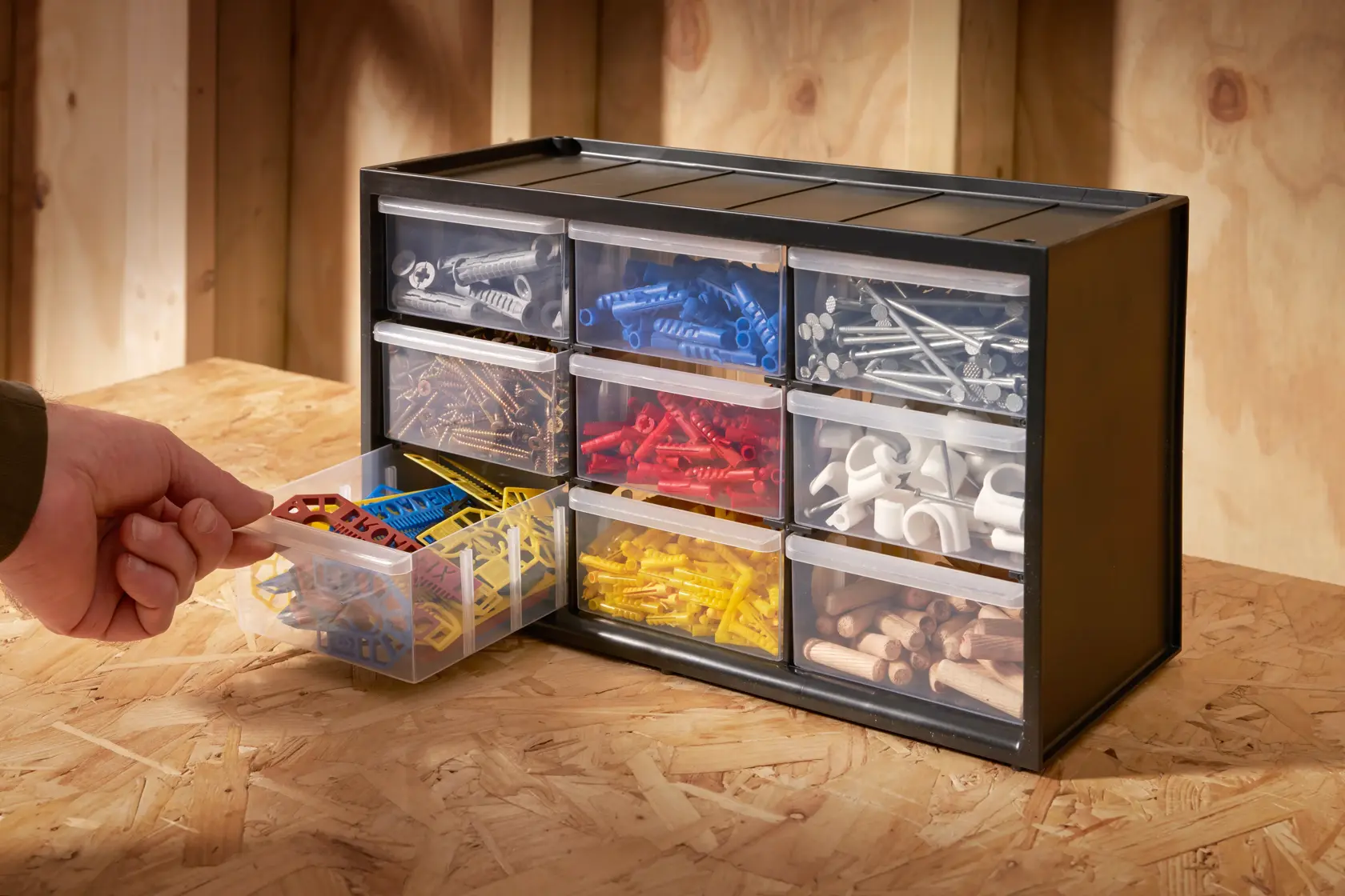 STANLEY 1-93-978 drawer organizer with assorted fasteners, viewed from the front on a workbench.
