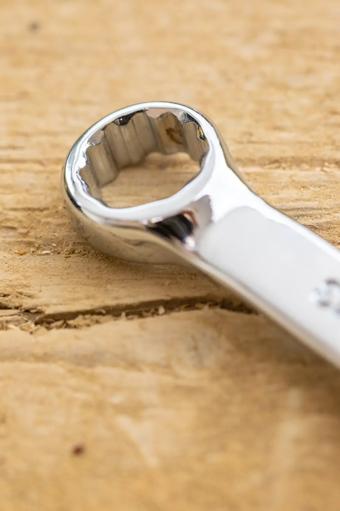STANLEY STMT95911-0 close-up photo of polished box-end wrench on wood surface.
